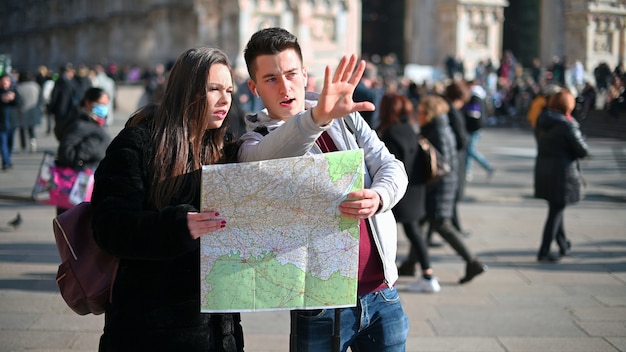 couple tourists city looking map discussing about destination 53419 8929